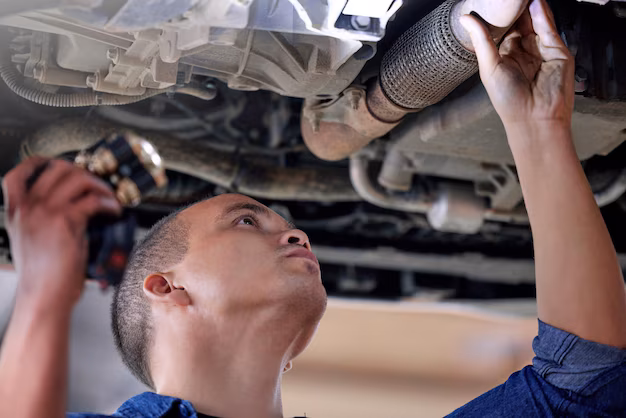 car-mechanic-garage-service-inspection-motor-vehicle-maintenance-safety-auto-shop-automobile-workshop-engineer-repairman-working-with-torch-check-vehicle-pipe-oil-leak